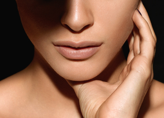 Closeup of a young woman with smooth and silky lips, makeup by Louise Wittlich